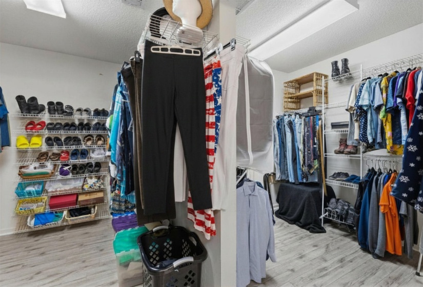 PRIMARY HIS/HER WALK-IN CLOSET (15x11)  Generous His/Hers Walk-In Closet with excellent storage and organization space.