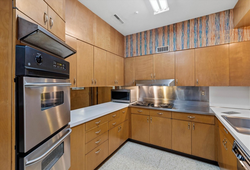 KITCHEN (20 x 15) - Well-appointed Kitchen featuring terrazzo floor, Sub-Zero refrigerator, prep sink, farm sink, mica countertops, 37 cabinets, 20 drawers, pull-out shelving, and pantry for abundant storage. BREAKFAST AREA (11x09).