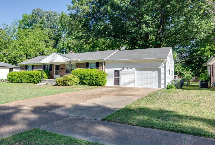 Brick and siding exterior featuring a covered front entry with white columns
