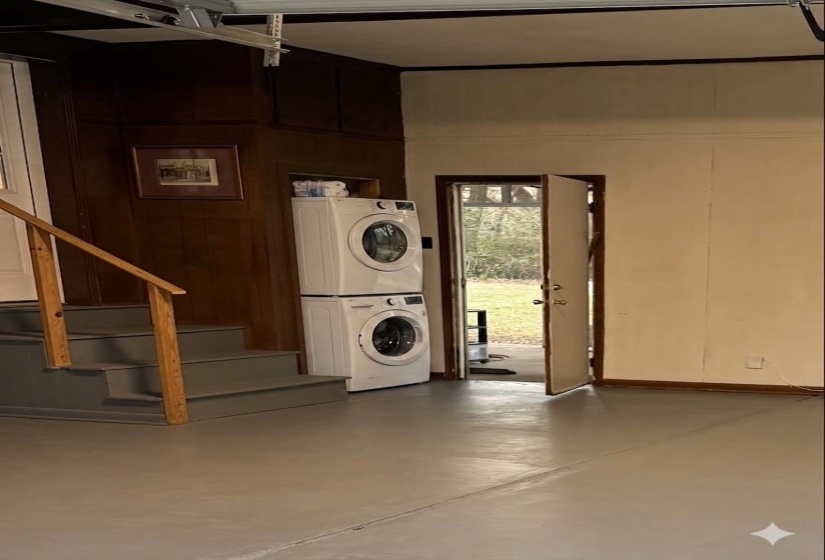 Garage with laundry space. Virtually staged.