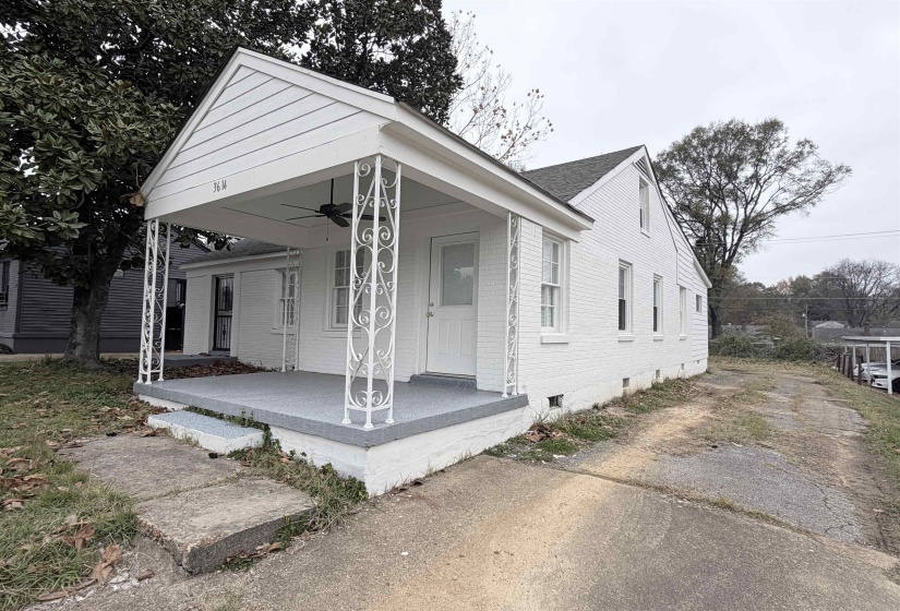 Shotgun-style home featuring a porch, crawl space, brick siding, and ceiling fan
