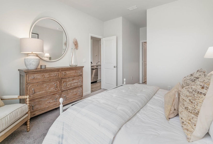 Bedroom with carpet floors and baseboards