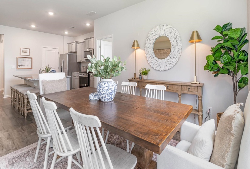 Dining space featuring wood finished floors and recessed lighting