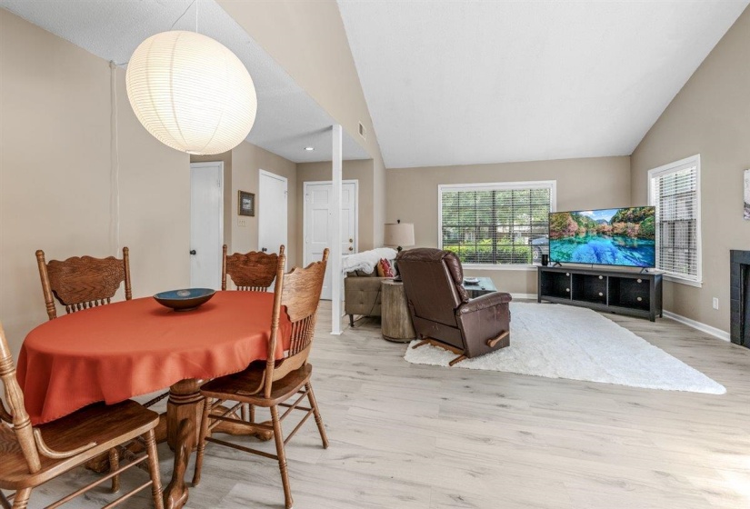 Open-concept living space featuring light wood-finish flooring throughout