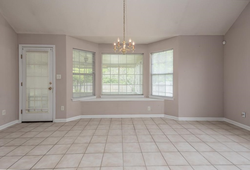 Spacious room with large bay windows and a built-in window seat