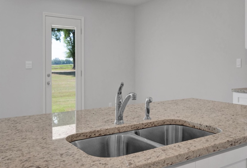 Kitchen island featuring a dual stainless steel sink and a chrome gooseneck faucet