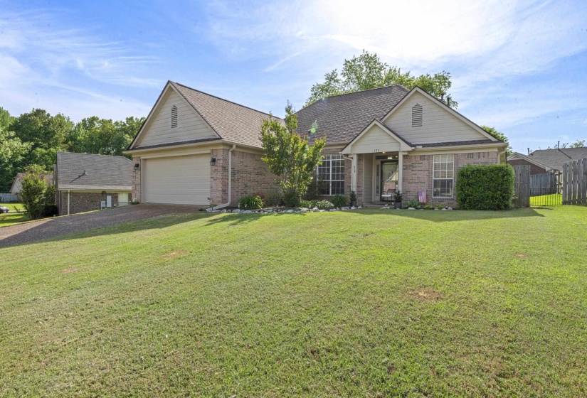 Brick exterior with light-colored siding accents and an attached two-car garage