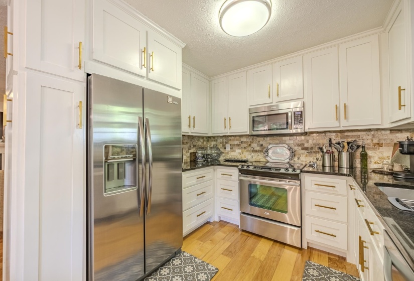 White cabinetry with gold-tone hardware