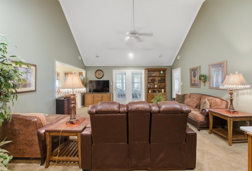 Vaulted ceiling with a ceiling fan
