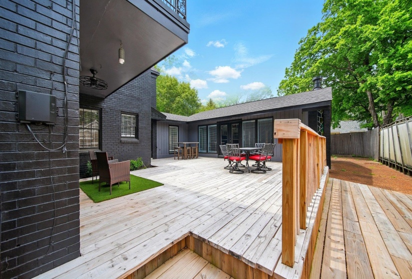 Wooden deck featuring outdoor dining area