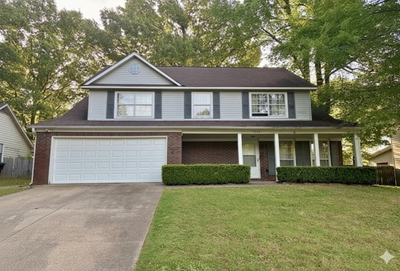 Two-story residence featuring a brick and siding exterior, a front porch with white columns, a two-car garage, and mature trees providing natural landscaping