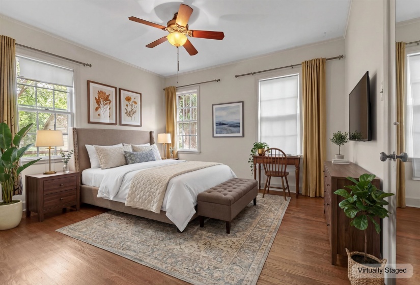 Hardwood-finish flooring featuring a ceiling fan with integrated lighting