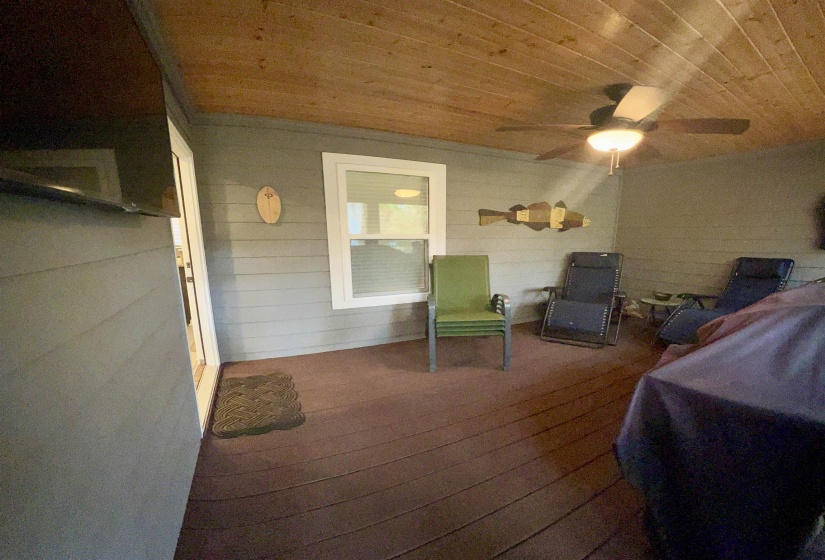 View of patio featuring a deck and a ceiling fan