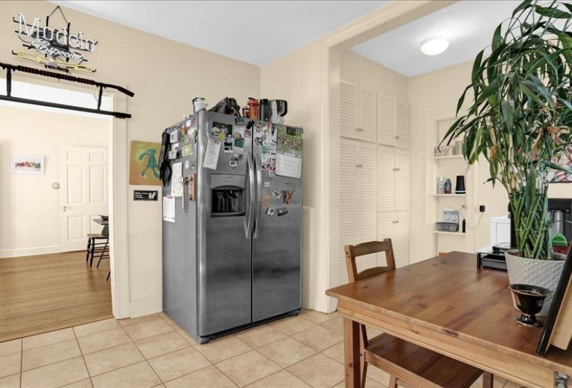 This area in the kitchen has built-in cabinetry, and corner shelving for pantry and more storage!