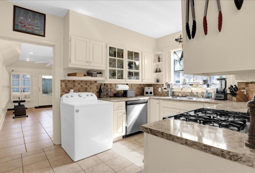 The flex room is through that kitchen doorway..let's go inside.