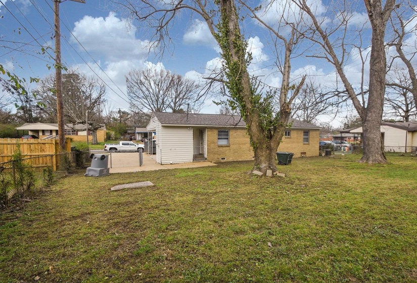 Back of property featuring a patio area and brick siding
