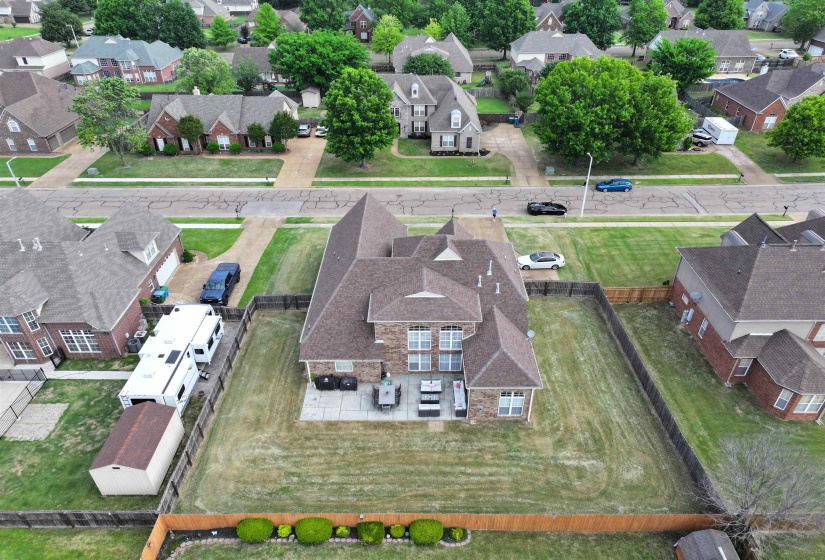 Two-story brick exterior with gabled roof lines and multiple windows