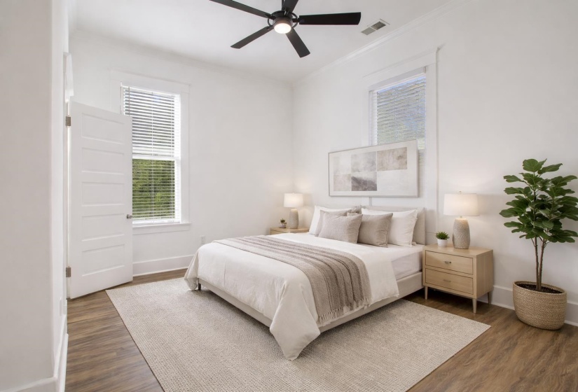 Bedroom featuring ceiling fan, dark wood finished floors, and crown molding
