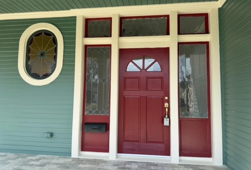 Property entrance with covered porch
