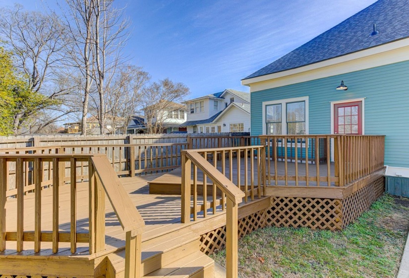 Wooden terrace featuring a residential view