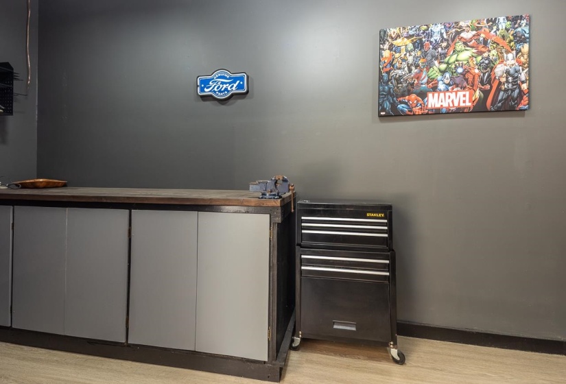 Indoor bar with light wood-type flooring and baseboards
