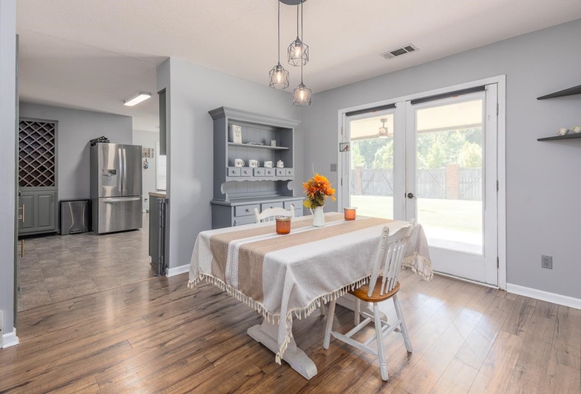 Dining area featuring light wood-style flooring and french doors