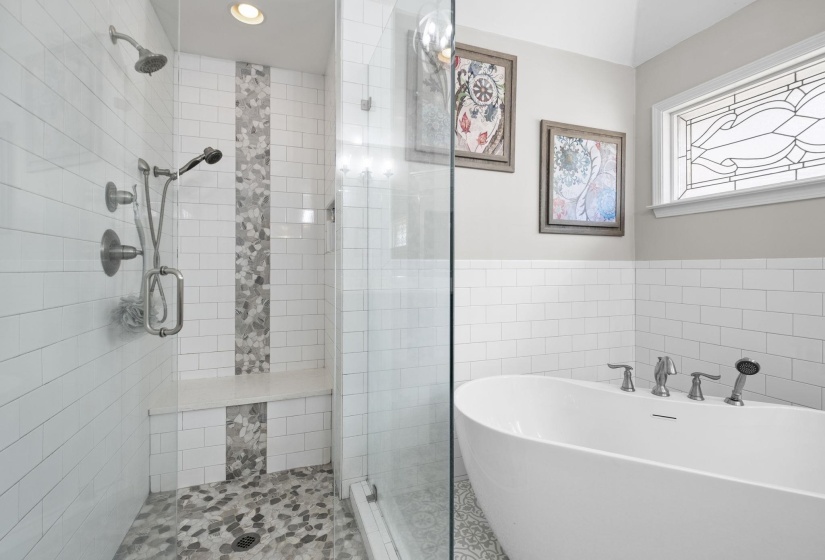 Contemporary bathroom featuring a freestanding soaking tub with deck-mounted fixtures, a walk-in shower with glass enclosure, and a built-in shower bench