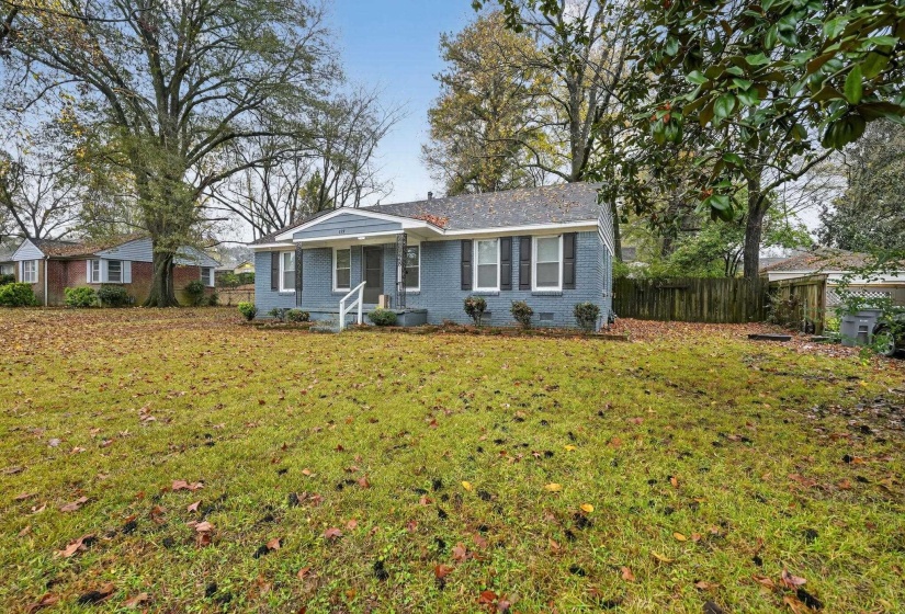 View of front of home with brick siding and crawl space