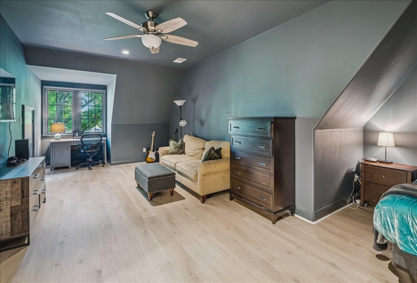 Light wood-finish flooring complements the room's two-tone wall treatment