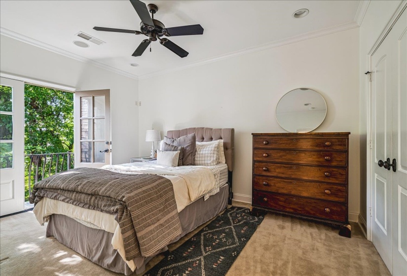 Bedroom with French doors opening to a balcony, featuring crown molding, recessed lighting, and a ceiling fan
