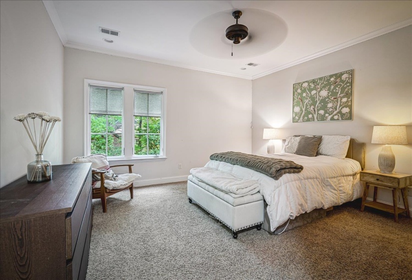 Carpeted room featuring a ceiling fan, recessed lighting, and a large window with white trim