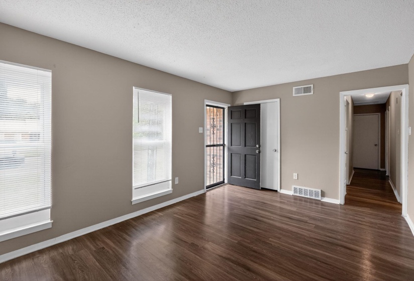Entryway featuring dark wood-type flooring and a textured ceiling