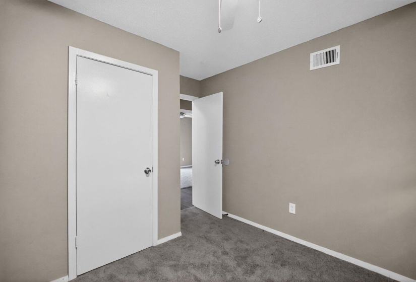Unfurnished bedroom featuring carpet and ceiling fan