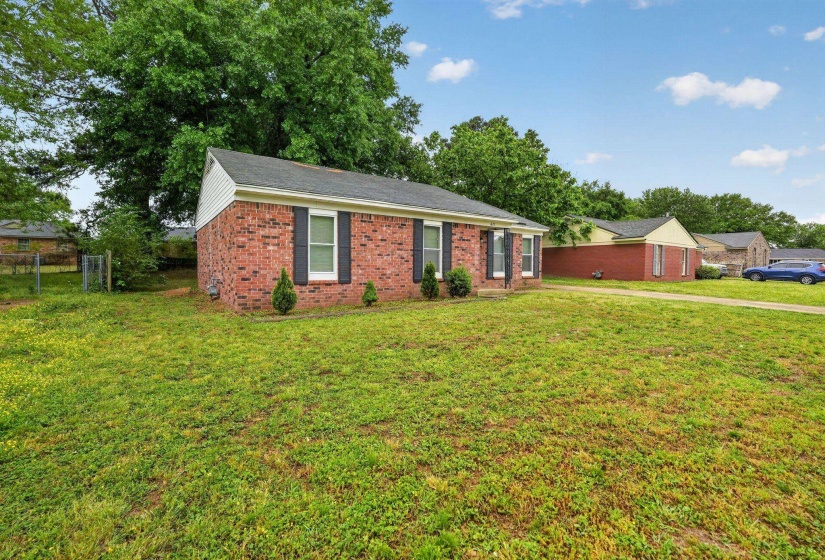 Ranch-style home featuring brick siding