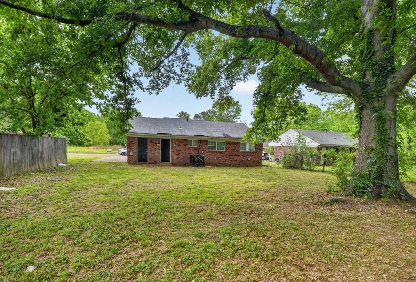 Back of property with brick siding