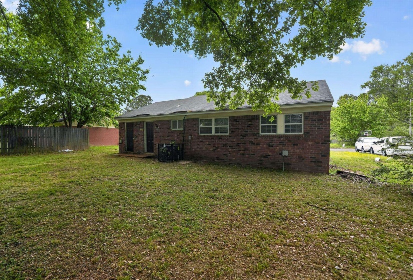Back of property with brick siding