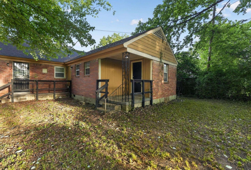 Brick exterior with a covered porch and an additional entry