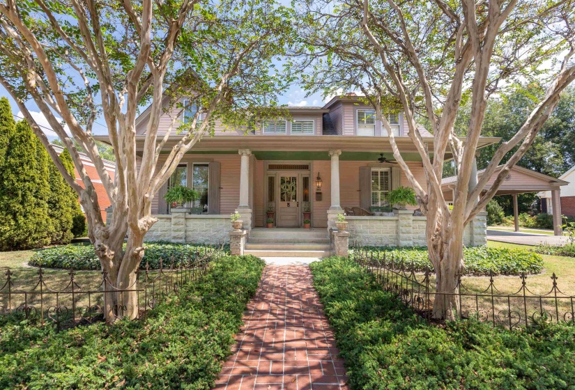 View of front of home featuring covered porch.