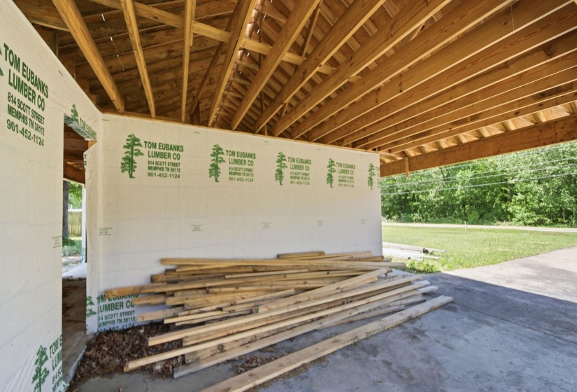 Exposed wood beam ceiling structure with a concrete foundation