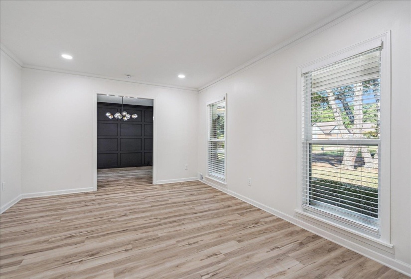 Light wood-finish flooring complements the neutral wall tones