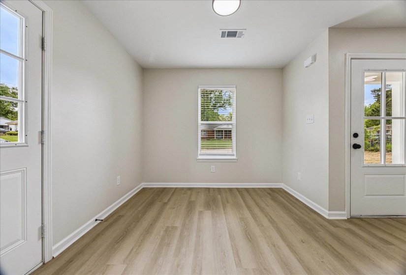 Bright interior space featuring light wood-finish flooring