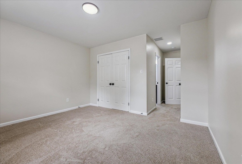 Neutral tone walls with white trim and baseboards