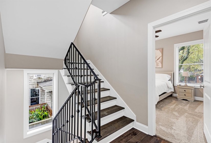 Stairs with baseboards and wood finished floors