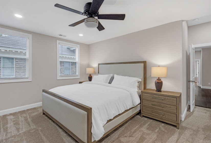 Bedroom featuring baseboards, light colored carpet, recessed lighting, and ceiling fan