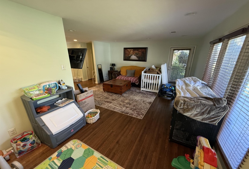 Bedroom with dark wood-type flooring