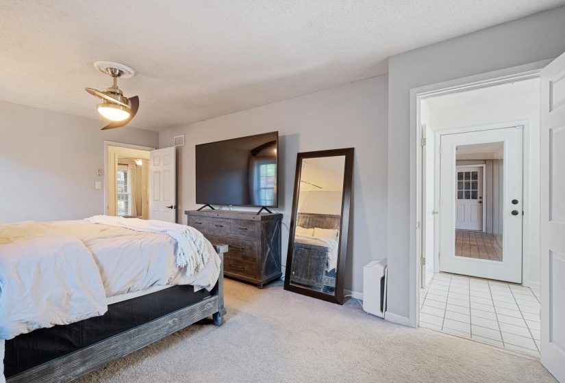 Room featuring a ceiling fan with integrated lighting, light gray wall paint, and beige carpet flooring