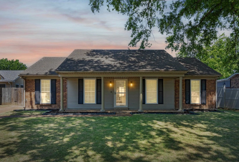 Traditional-style residence featuring a combination of brick and siding facade