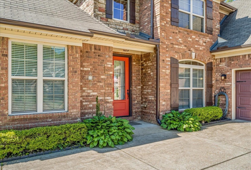 Brick exterior with stone accents and  stunning entry door