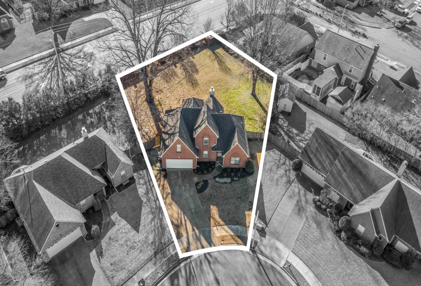 Aerial view of residential area with property boundaries highlighted