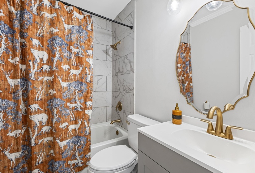 Bathroom with vanity and shower / bath combo